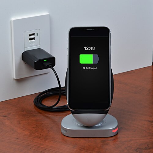 Additional Image 4 - a phone charging on a charging station