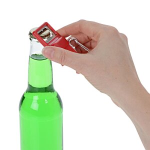 Additional Image 3 - a hand holding a bottle of green liquid