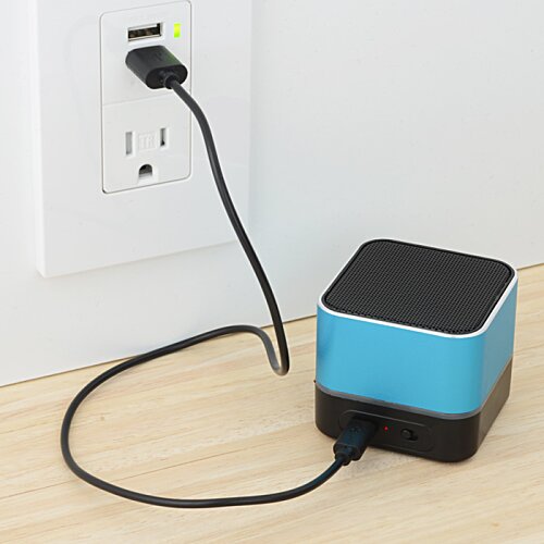 Additional Image 4 - a black and blue cube with a cord plugged into a wall outlet