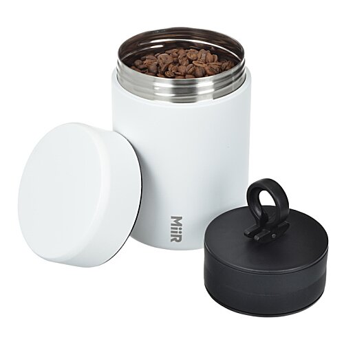 Additional Image 1 - a black container with brown powder inside
