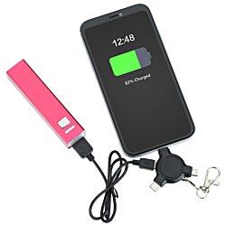 a black rectangular object with a green rectangle on it next to a pink object