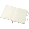 a white notebook with a string