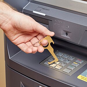 Additional Image 1 - a hand holding a key to a machine