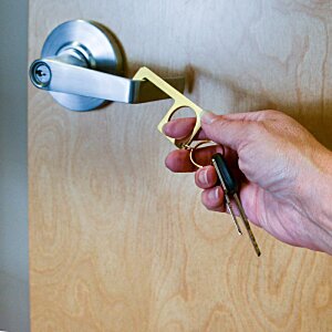 Additional Image 1 - a person holding a key in their hand