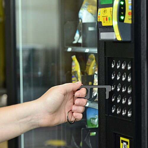 Additional Image 5 - a hand opening a vending machine