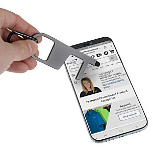 Additional Image 2 - a hand holding a keychain over a cellphone