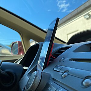 Additional Image 3 - a close up of a phone in a car