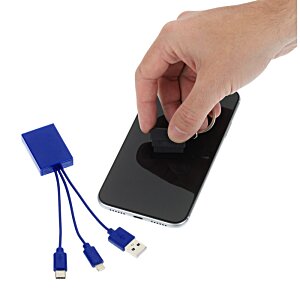 Additional Image 1 - a hand holding a phone and a charger