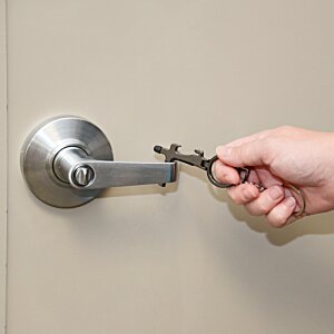 Additional Image 4 - a hand holding a key to a door handle