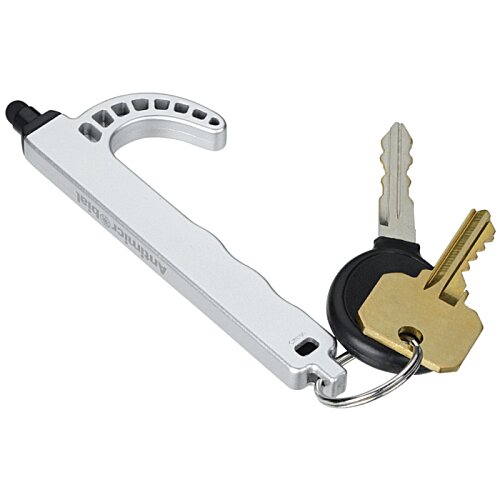 Additional Image 1 - a white and black metal handle with a gold key