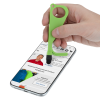 a hand holding a green tool over a cell phone