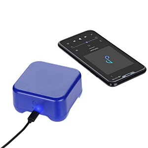 Additional Image 3 - a blue square device next to a black cell phone