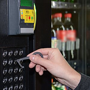 Additional Image 3 - a hand holding a key to a machine