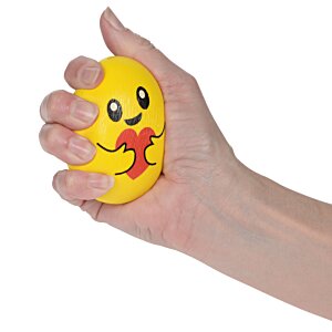 Additional Image 1 - a hand holding a yellow ball with a face on it