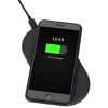a phone charging on a wireless charger
