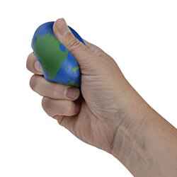 a hand holding a blue and green object