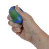 a hand holding a blue and green object