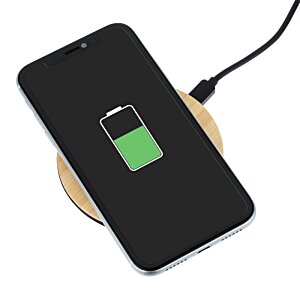 Additional Image 4 - a black phone with a green battery on a wireless charger