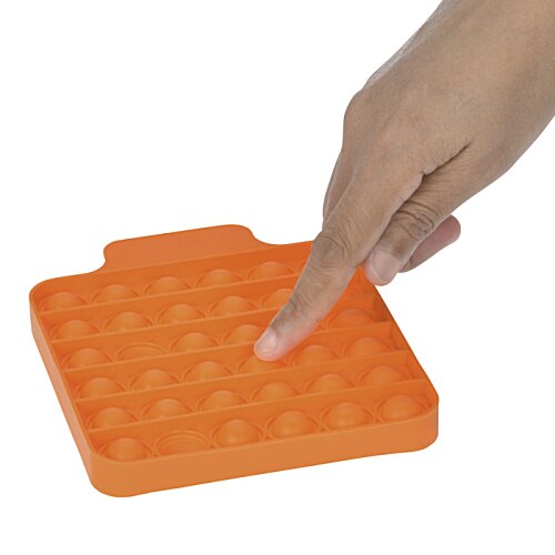 Additional Image 3 - a finger touching an orange square