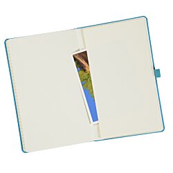a white book with a blue pen