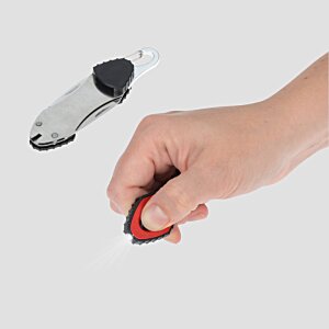 Additional Image 4 - a hand holding a red and black tape measure