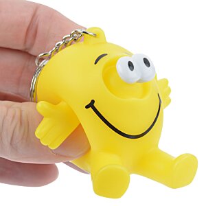 Additional Image 1 - a hand holding a yellow toy