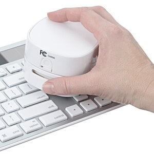 Additional Image 6 - a hand holding a white round object on a keyboard