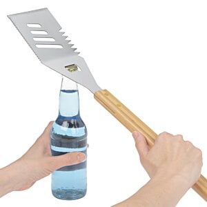 Additional Image 2 - a hand holding a spatula over a bottle of water