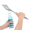 Additional Image 3 - a person holding a spatula over a bottle