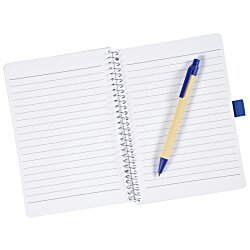 a notebook and pen on a white background
