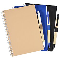 a stack of notebooks with pens