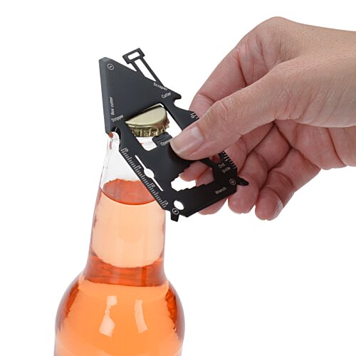 Additional Image 6 - a hand holding a black object over a bottle