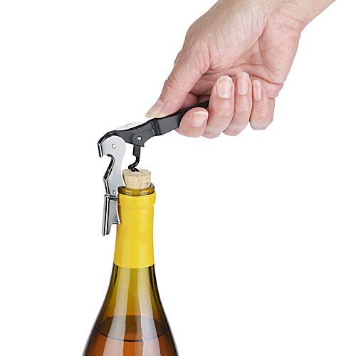 Additional Image 4 - a hand opening a bottle of wine