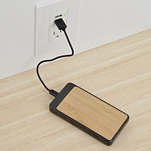 Additional Image 5 - a phone charging on a table