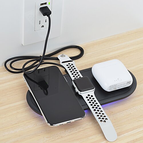 Additional Image 2 - a smart watch and phone on a charger