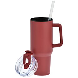 a red coffee mug with a straw