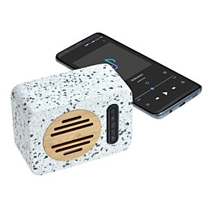 Additional Image 2 - a white cube with a brown circle on top next to a black cell phone