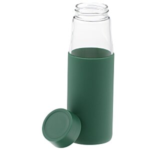 Additional Image 1 - a bottle with a green liquid in it