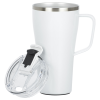 a white mug with a handle and a mouse