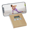 a woman in purple yoga outfit on a scale