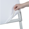 a hand pulling a white sheet of paper