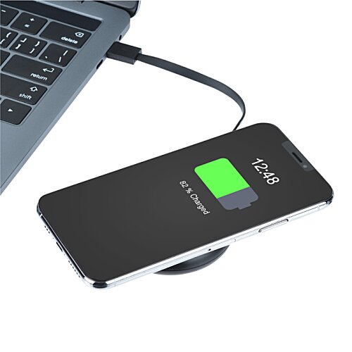 Additional Image 3 - a phone charging on a wireless charger