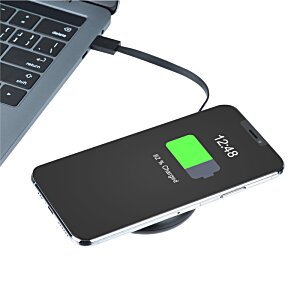 Additional Image 3 - a phone charging on a wireless charger