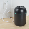 a black cylindrical object with a green stripe