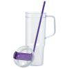 a purple straw in a glass cup