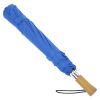 a blue umbrella with a wooden handle