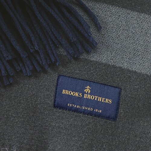 Additional Image 2 - a blue tag with yellow text on a grey surface