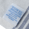 Additional Image 3 - a white label with blue text