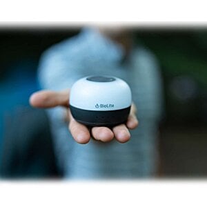 Additional Image 10 - a person holding a small round object