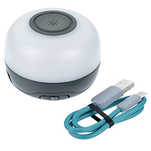 Additional Image 1 - a round object with a round black button and a blue cord